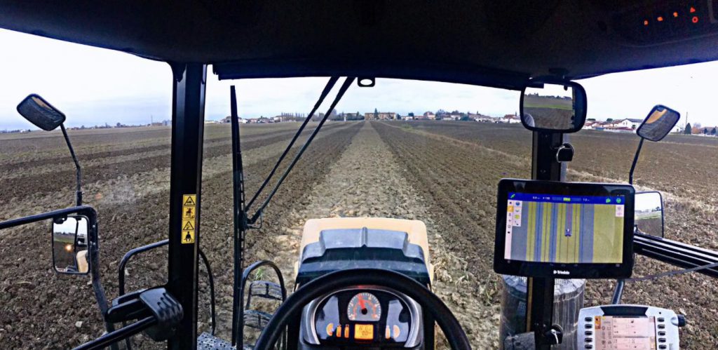 view inside tractor cab with steering guidance system